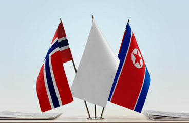 Flags of Norway and North Korea with a white flag in the middle