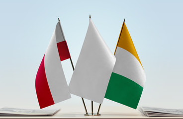 Flags of Poland and Ivory Coast with a white flag in the middle