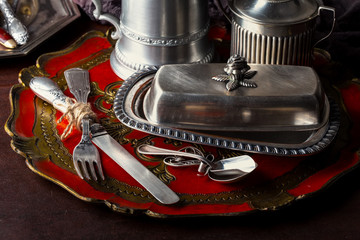 Old silver dishes with accessories for the kitchen