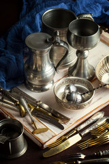 Old silver dishes with accessories for the kitchen