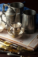 Old silver dishes with accessories for the kitchen