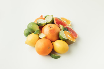 Heap of citrus fruits isolated on white background