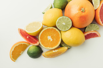 Assorted juicy citruses isolated on white background