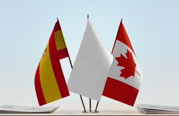 Flags of Spain and Canada with a white flag in the middle