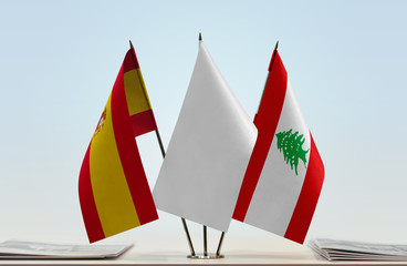 Flags of Spain and Lebanon with a white flag in the middle