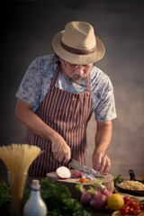 Man cook chef hipster with handsome bearded face in a hat