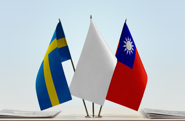 Flags of Sweden and Taiwan with a white flag in the middle