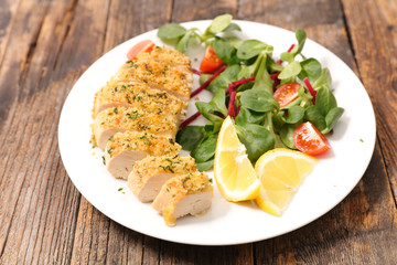 fried chicken breast and salad