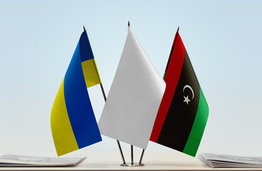 Flags of Ukraine and Libya with a white flag in the middle
