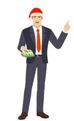 Businessman with cash money pointing somewhere