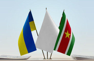 Flags of Ukraine and Suriname with a white flag in the middle