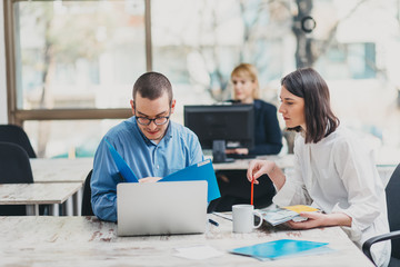 Colleagues working in office