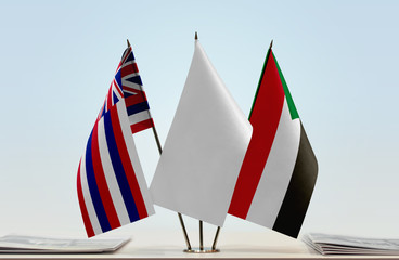 Flags of Hawaii and Sudan with a white flag in the middle