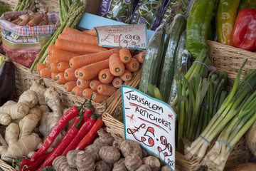The High Street Broadway Village Worcesteshire English Cotswolds England UK. Fruit and vegetables are shown outside a grocery / greengrocery store.