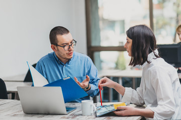 Colleagues working in office