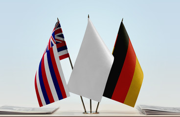 Flags of Hawaii and Germany with a white flag in the middle