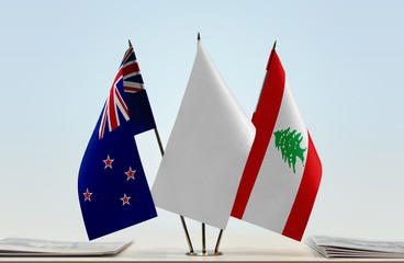 Flags of New Zealand and Lebanon with a white flag in the middle