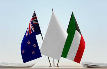 Flags of New Zealand and Kuwait with a white flag in the middle
