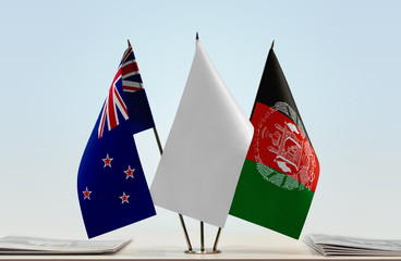 Flags of New Zealand and Afghanistan with a white flag in the middle