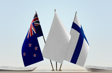 Flags of New Zealand and Finland with a white flag in the middle