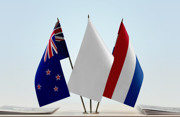 Flags of New Zealand and Netherlands with a white flag in the middle