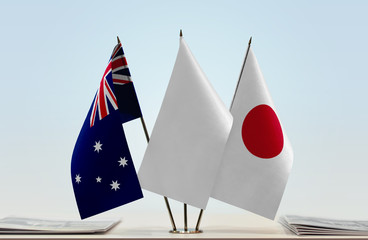 Flags of Australia and Japan with a white flag in the middle