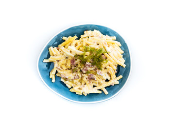 Italian food macaroni gratin with ham on table