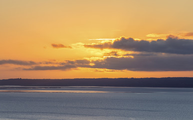 Fototapeta na wymiar Orange Warm Sunset Clouuds over Llandudno Bay