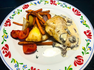 Chicken fillet, creamy sauce with mushrooms, stewed vegetables