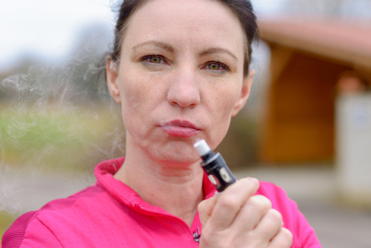 Mature Woman Smoking An E-cigarette