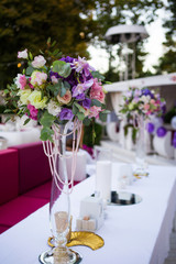 Flower decoration on festive table in open air cafe