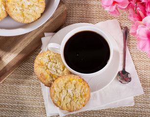 Overhead view of lemon crackle cookies and cup of coffee