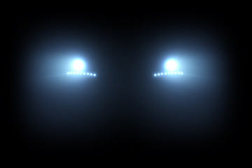 Car head lights shining from darkness © More Images