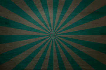 Dark teal green and grey slate background - with retro starburst in alternating stripes - abstract stone background