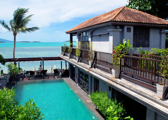 Cozy villa with the letter N in the center of a pool with a view of the stunning blue sea bay