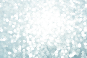 blue white glittering Christmas lights. Blurred abstract background