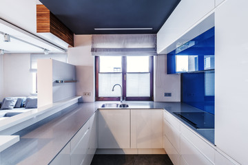 Fototapeta na wymiar White and blue modern kitchen