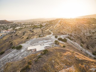 Aerial bird's eye view of UNESCO world heritage site Choirokoitia, Larnaca, Cyprus. View of Khirokoitia, a prehistoric ancient neolithic archaelogical settlement with round houses, from above.
