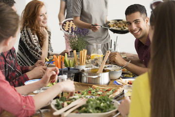 Smiling spanish man eating lunch