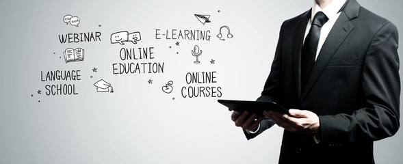 Online Education with man holding a tablet computer