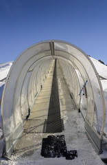 Ski conveyor belt up to expert ski runs in Pila, Valle d'Aosta, Italy resort in Italian Alps