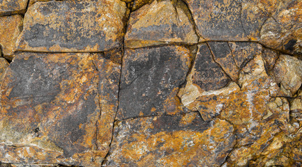 Abstract background of stone wall texture. Cracked stone texture background. Old stone