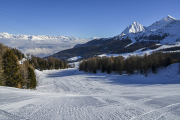 Perfectly groomed empty ski piste in Pila, Valle d'Aosta, Italy