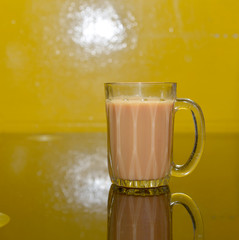 Teh tarik or pulled tea is a famous sweet milk tea in Malaysia. Bubble is floating on the surface of teh tarik.