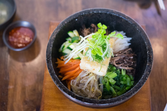 Bibimbap in a heated stone bowl korean style food