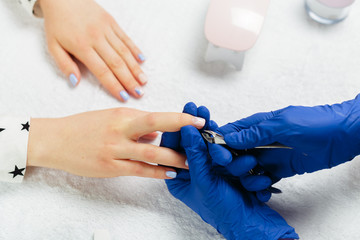 Woman hands receiving a manicure in beauty salon