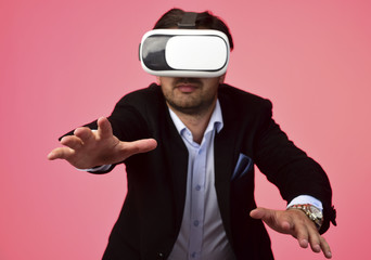 Arab Man experiencing virtual reality wearing virtual reality glasses