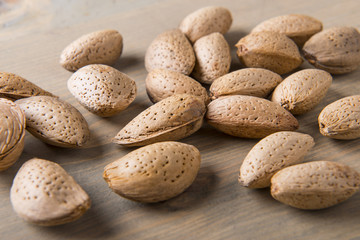 Almonds on wooden table