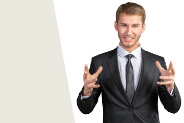 Scared and astonished young businessman