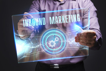 The concept of business, technology, the Internet and the network. A young entrepreneur working on a virtual screen of the future and sees the inscription: Inbound marketing